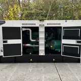 200 kW Volvo generator with the enclosure doors open showing the engine and alternator
