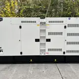 200 kW Volvo diesel generator in a white silent-type enclosure, outdoors