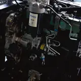 Perkins 404D-22G diesel engine inside the 20 kW generator enclosure, fuel filter side