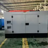 30 kW Cummins diesel generator in a grey silent-type enclosure, front view