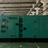 50 kW Cummins LPG generator in a green silent-type enclosure, front view