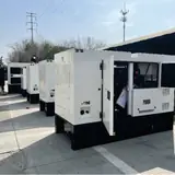 50 kW natural gas generator enclosure with a service door open