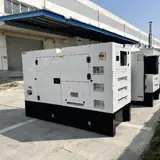 50 kW Cummins natural gas generator enclosure, angled view with more units behind