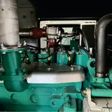Top of the Cummins gas engine with exhaust riser and intake piping