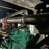 Exhaust pipe and gas train above the ignition coils of the Cummins gas engine